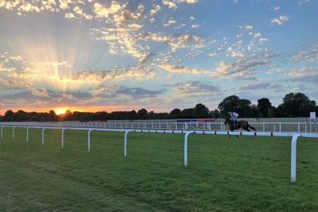 Windsor racecourse jockey at sunset